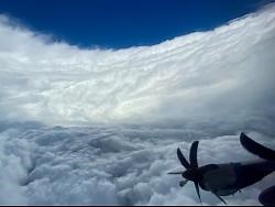 Weakened Hurricane Epsilon moves north over Atlantic Ocean