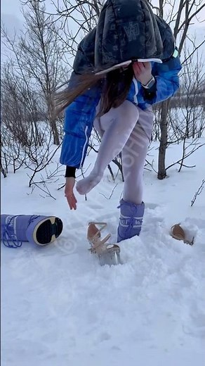 Gorgeous girl in Duvetica and Moon boots hard stuck in very deep snow Killer heels barefoot