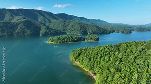 Afternoon aerial footage of the boaters and island on beautiful Watauga Lake in eastern, Tn.