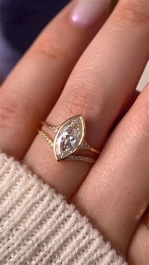 Onyx Jewels Mv on Instagram: "The perfect bridal stack featuring a marquise-cut bezel engagement ring, paired with a perfectly contoured wedding band 😍 inspiration for brides who love strong lines, elegant proportions, and a design that feels effortlessly elevated. The marquise silhouette brings a distinctive presence, while the bezel setting adds a modern edge and a sense of quiet confidence. Crafted in 14K premium gold and set with authentic VVS, D–F color, excellent-cut lab-grown diamonds, e