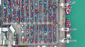 Container ship loading and unloading in seaport, Aerial top view of business logistic import and export freight transportation by container ship, Container loading cargo freight ship, Time Lapse 4K.