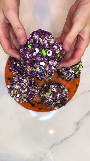 Halloween Popcorn Balls • Recipe: 1/2 stick butter, 5C marshmallows, 12C popcorn, purple food coloring, 1/2C sprinkles, candy eyeballs • • • Directions: melt butter on medium heat. Add marshmallows and stir constantly until melted. Remove from heat, stir in food coloring. Pour onto popcorn and stir, add sprinkles and mix. Put butter on hands and form into balls. Press eyeballs into the balls. Remember to work quickly! • • #halloween #popcorn #popcorn🍿 #ball #balls #popcornballs #holiday #hallow