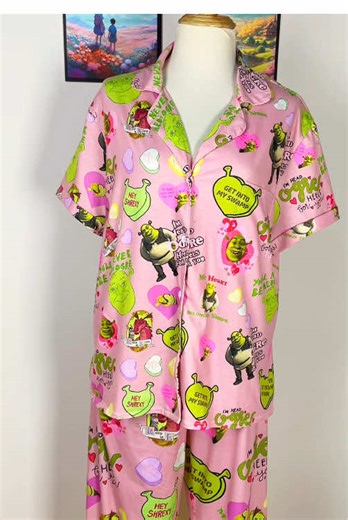 Get out of my swamp and into these PJs! 💚 Ogres have layers, and so does your style. These pink Shrek pajamas are actually adorable. Shrek is love, Shrek is life. 🧅✨ #Shrek #ShrekIsLove #Dreamworks #FunnyPajamas #GetIntoMySwamp