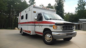 This Ambulance Was Converted Into an Off-Grid-Ready "Motocross Camper" With a Bike Garage