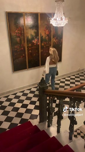 Elegant Staircase Walk with Fashionable Blonde