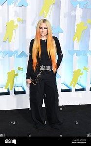 Avril Lavigne walking on the black carpet at the 2022 MTV Video Music Awards held at the Prudential Center in Newark, NJ on August 28, 2022. (Photo by Efren Landaos/Sipa USA Stock Photo - Alamy