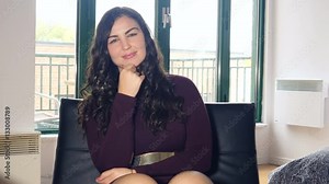 Beautiful plus size model woman on Skype video chat - computer point of view