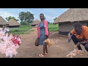 SLAUGHTERING CHICKEN//African village.