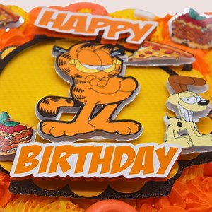 Are you as excited as we are for the launch of the new Garfield movie? Our Garfield Tear ‘n Share Cupcake Cakes are now available for order! Don’t miss out on our Garfield-themed goodies launching next week. Be sure to keep an eye on our pages! 🐱🍝 Our Garfield Tear ‘n Share Cupcake Cake is a delightful treat that combines the joy of cupcakes with the beloved charm of Garfield. Available in 12 or 24 scrumptious cupcakes, this cake is perfect for sharing with friends, family, or fellow Garfield 