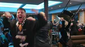 Scotland fans celebrate with hugs, chants and cheers at Glasgow's Clockwork bar as their team secures a dramatic 4-2 victory over Denmark, clinching a spot in the 2026 World Cup. | AFP News Agency