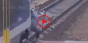 Woman miraculously survives train accident, video goes viral