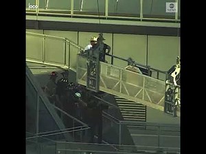 Dramatic rescue as window washers are saved from platform swinging out of control | ABC News