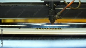 CNC machine cutting wood with a laser. CNC machine at work. Close-up.