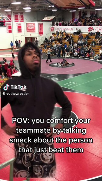 Exciting Wrestling Match in Gymnasium