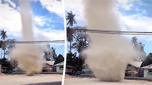 Towering dust devil spins toward school in Malaysia street scare