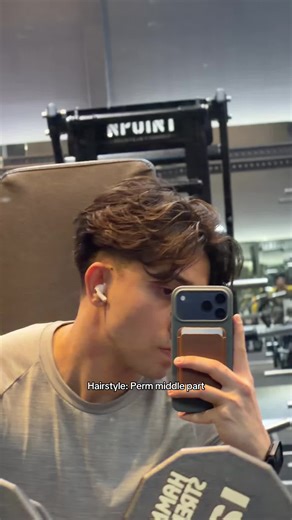 Embrace the Perm Era with a Middle Part Hairstyle