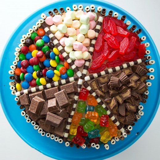 Make everyone happy with this multi-flavored cake made with chocolate and vanilla cake mix filled and topped with all sorts of goodies. | Sugar Fix