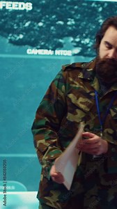 Vertical Video Commanding general of the navy division reviews warfare information within a mission case file, special operation reconnaissance to support field troops. Briefing his military squad