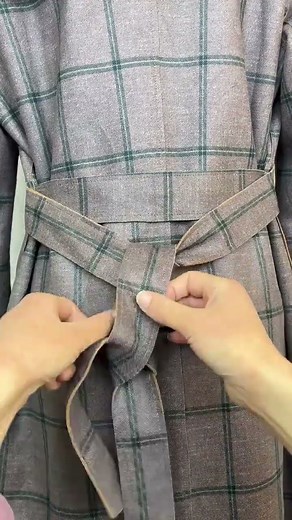 This girl shows how to tie a knot well.