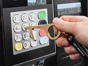 The CleanKey cuts your exposure to infected surfaces by opening doors and pressing buttons for you