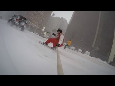 Watch This Daredevil Snowboard Through New York City Being Pulled by a Car