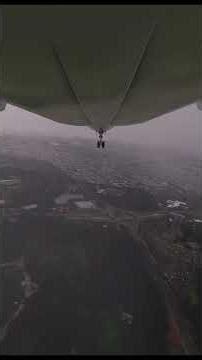 Boeing 787 landing at El Dorado Airport in Bogotá under heavy rain