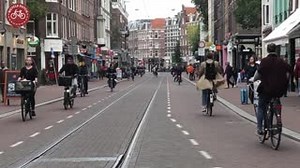 In the 1970s, Amsterdam's Ferdinand Bolstraat was considered a major arterial, but residents fought a fierce battle to get rid of the cars. After years of metro construction, it was rebuilt and reopened in 2018 as a street for trams, cycling, and walking: http://ow.ly/kc0f50wGytC | Dutch Cycling Embassy
