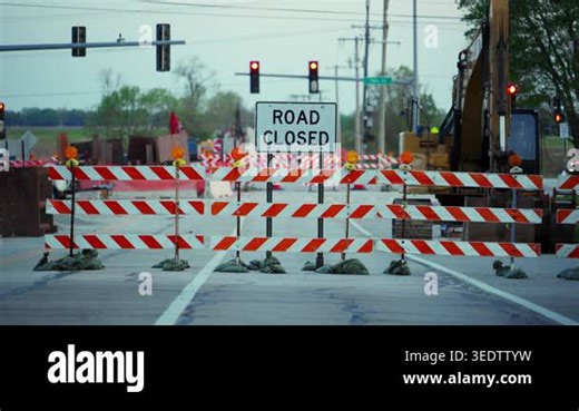 Blocked roadway with barricades and warning sign ROAD CLOSED showing restricted access and construction area. High quality 4k footage Stock Video Footage - Alamy