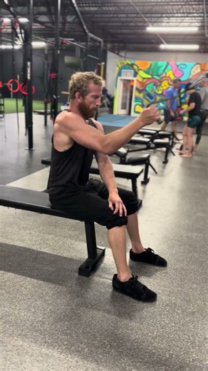 Seated single arm cable row w/ cross crawl connection