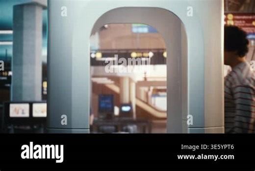 Young Male Passenger During Security Check. Man Stands Still With Hands Raised Inside Scanner, While Airport Busy Background. Routine Steps Every Passenger Must Take Before Entering Gate Area Stock Video Footage - Alamy