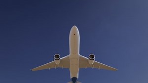 clip-1098473595-airplane-flying-on-clear-blue-sky