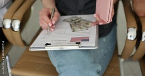 Group of people fills out US visa application form holding dollar passport. US citizenship and relocation