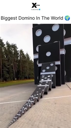 Explaining on Instagram: "The video shows a huge domino chain reaction. It starts with a small push on tiny dominos and ends with very large, multi-story domino structures falling one after another. The setup is outdoors among trees and looks carefully planned, stretching about 50 meters. It was posted on December 2, 2025, by @bangetsih__, an account that shares viral videos. In less than 24 hours, it reached 228,000 views. Many Indonesian viewers were amazed by how big it was and guessed it too