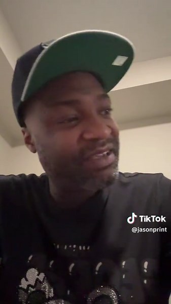 Distinctive Style Showcase with Dark Shirt and Green Cap