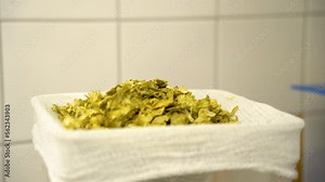 Measuring hops for adding to the mash in the process of brewing beer