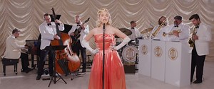 77K views · 1.4K reactions | You'll recognize the words to this one... Taking a '90s Faith Hill classic back to the days of Doris Day - Tatum Langley stars in this 1940s Big Band style remake  Go back in time with Postmodern Jukebox live on tour! 2025 World Tour tix at www.pmjtour.com | Postmodern Jukebox | Facebook