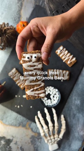 The only thing scary about these Mummy Granola Bars is how easy they are to make! Hauntingly delicious and creepily crunchy, these treats feature your favorite flavor of Kodiak® Crunchy Granola Bars, with whole grains and protein to fuel every goblin and ghoul... Ingredients: • 1 box (6 packs) Kodiak Crunchy Granola Bars (any flavor) • 3/4 cup powdered sugar • 1-2 tablespoons milk • 1/4 teaspoon vanilla • 24 candy eyeballs or mini chocolate chips Directions: 1. Remove crunchy granola bars from p