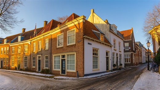 Walking through snowy streets of medieval Amersfoort