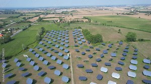 Silicon photovoltaic panels with defective single-axis tilted track system In a small solar power plant.