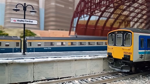 A photographer was preparing to take a photo of a Class 150 in platform 4 when the Inverness sleeper train passed non-stop through platform 7 headed by Class 37 37114 "Dunrobin Castle" | Arpley Central