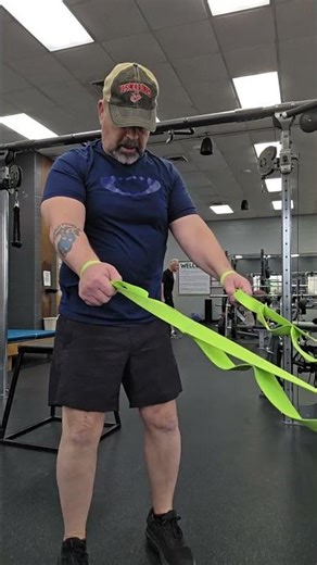 Squats using straps to improve knee flexion