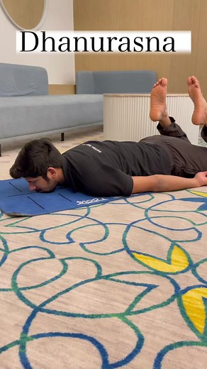 Dhanurasana, also known as the Bow Pose in yoga, offers several benefits:1. **Strengthens the Back:** Dhanurasana helps strengthen the muscles of the back, including the lower back, which can alleviate back pain and improve posture.2. **Flexibility:** This pose enhances flexibility in the spine, shoulders, and chest.3. **Tones Abdominal Organs:** It stimulates and tones the abdominal organs, aiding digestion and improving the functioning of the digestive system.4. **Respiratory Health:** Dhanura