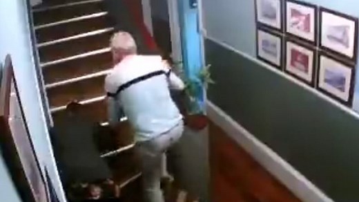 Sozzled couple holding drinks struggling to walk tumble down stairs