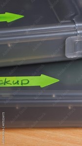 External hard drive and boxes with HDD with backup text label. Electro-mechanical data storage device stores and retrieves digital data using magnetic storage. Save information. 2.5-inch form factor