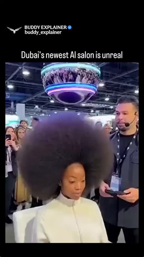 BUDDY EXPLAINER on Instagram: "The post showcases a viral demonstration of Dubai’s AI Hair Dome at a tech expo, where a participant’s large afro is transformed into smooth, straight hair in under 10 seconds. The device uses automated heat control and AI-guided styling, creating a transformation so fast and flawless that the crowd bursts into shock and excitement. Most viewer reactions — especially from Indonesian users — describe the result as “magic,” amazed by the speed, softness, and salon-qu