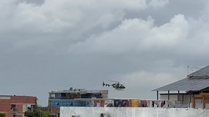 819K views · 11K reactions | 23 July 2024: Since I cannot go out because of curfew, decide to continue writing despatches. At around 12:15 helicopter starts flying low overhead. Go to rooftop of tall building next door and hide in the bushes to video military helicopter circling and occasionally flying very low, by people’s windows. I’ve never seen a helicopter flying so low in built up areas before. Watch entire clip! | Shahidul Alam | Facebook