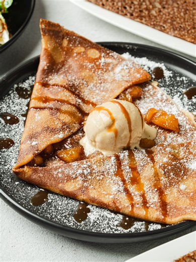 Crepe Glazik on Instagram: "Behind every dessert lies a memory — and for Neven, the Pommes Caramélisées is one of home. 🍎✨ In Brittany, apples aren’t just fruit — they’re tradition. This classic Breton dessert celebrates the region’s love for simple, heartfelt flavors: apples slowly cooked in butter and sugar until golden and tender, wrapped in a delicate crêpe that feels like home with every bite. A timeless taste of Brittany — rooted in tradition, served with grace. #CrepeGlazik #Crepes #crep