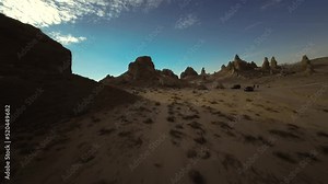 Trona pinnacles in California's Mojave and Death Valley desert - first-person aerial view along the contours of the rugged landscape