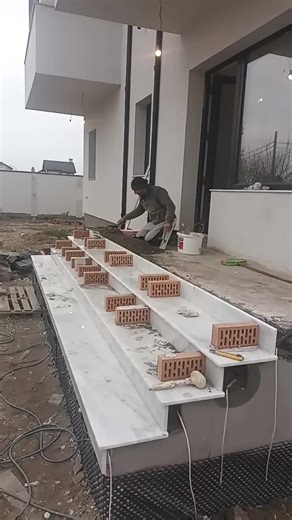 Constructing a Brick Staircase Outside Modern Building