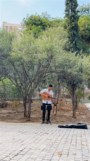 Live music, the Acropolis, and olive trees swaying in the background - sometimes it’s the simplest things that stay with you 🎶🤍 Street musicians bringing Athens to life this summer =) #TheBridgeMusic #Buskers #Athens #Greece #Acropolis #TheBridge #SaturdayVibes | Thebridge.music